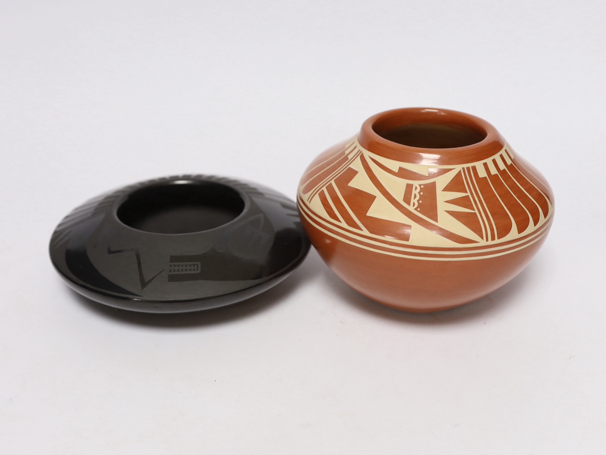 Two North American studio pottery vessels; a Marvin and Frances Martinez pottery bowl and a Kathy Gutierrez burnished bowl, tallest 10cm